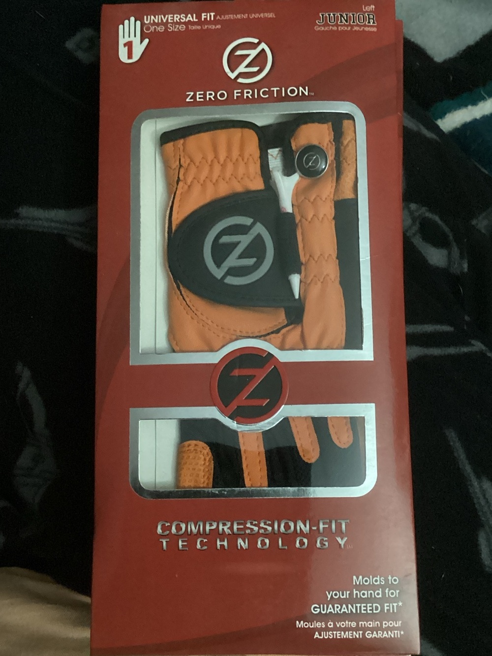 Zero Friction Junior Golf Glove in Orange and Black